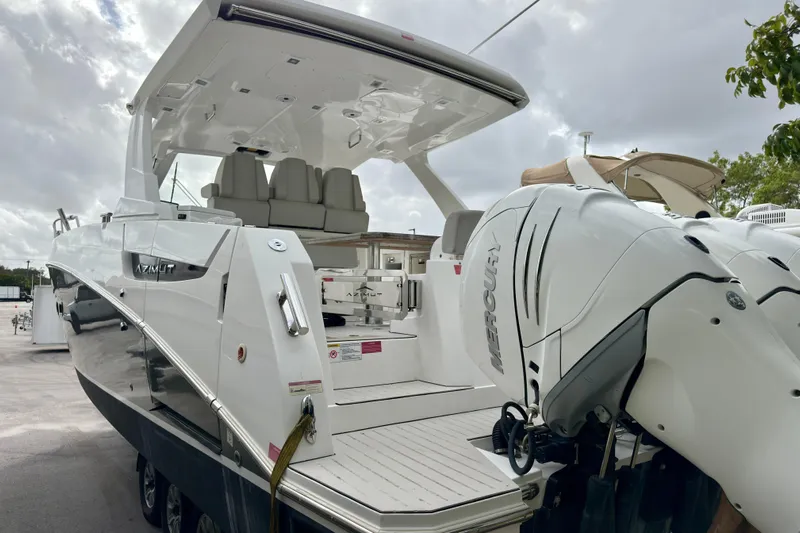  Yacht Photos Pics 2019 Azimut Verve 40 yacht with Mercury outboard engines, docked under cloudy skies.