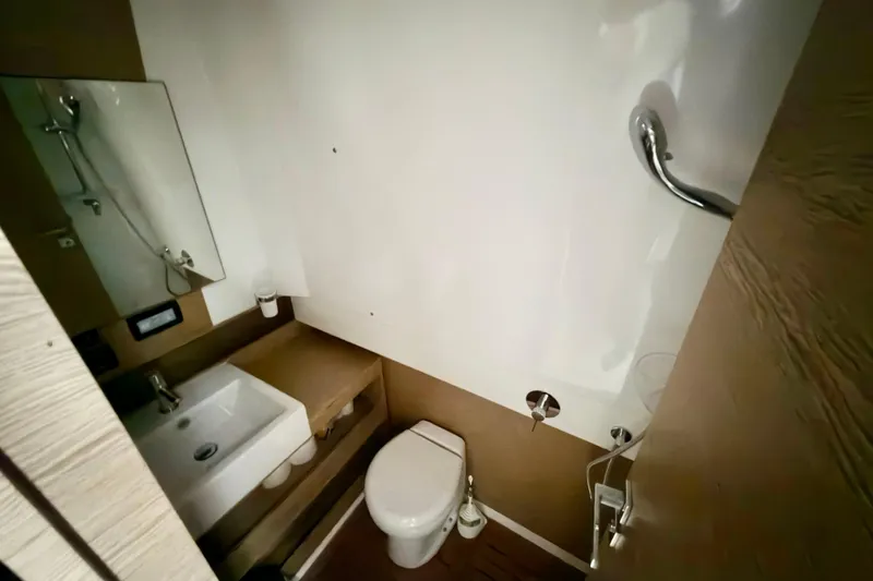  Yacht Photos Pics Bathroom interior of 2019 Azimut Verve 40 yacht, featuring sink and toilet.