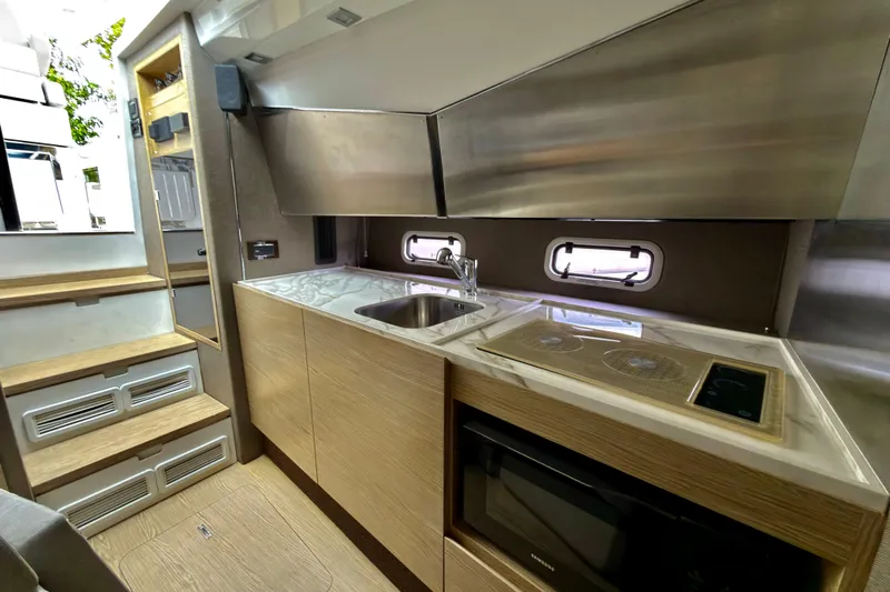  Yacht Photos Pics 2019 Azimut Verve 40 yacht interior kitchen with modern appliances and sleek design.