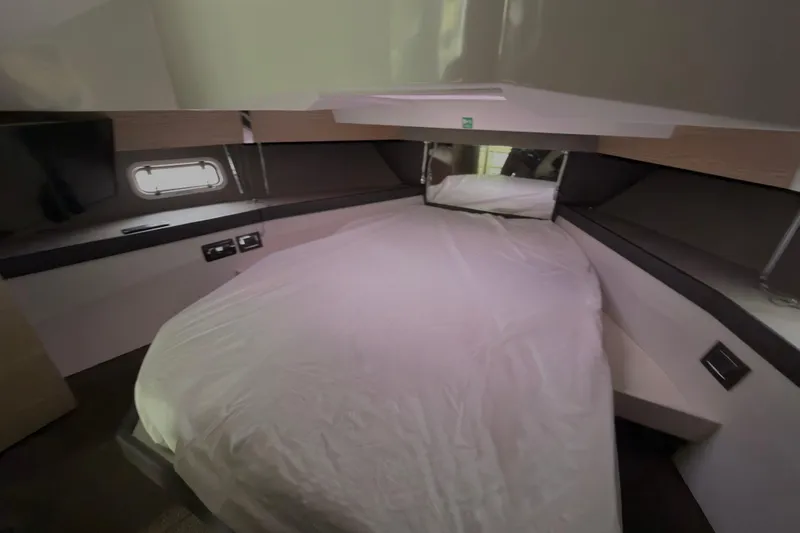  Yacht Photos Pics Interior cabin of 2019 Azimut Verve 40 yacht with bed and window.