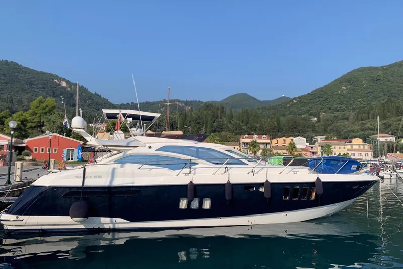  Yacht Photos Pics Luxury 2007 Absolute 56 HT yacht docked in scenic marina with hills.