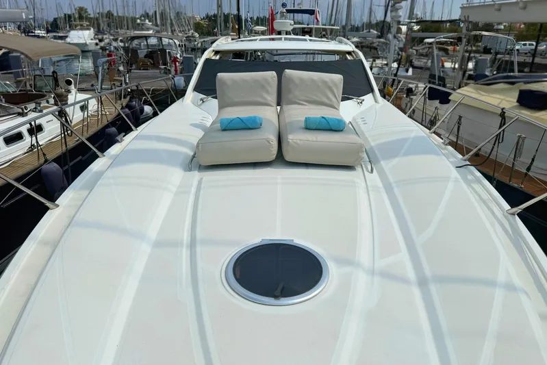  Yacht Photos Pics Luxury Absolute 56 HT yacht deck with sun loungers, docked in a marina, 2007 model.