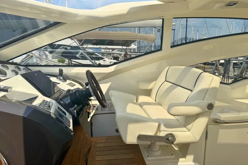  Yacht Photos Pics Luxurious helm of 2007 Absolute 56 HT yacht with modern controls and plush seating.