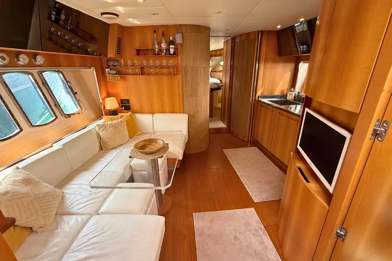  Yacht Photos Pics Luxurious interior of 2007 Absolute 56 HT yacht with modern furnishings and wooden accents.