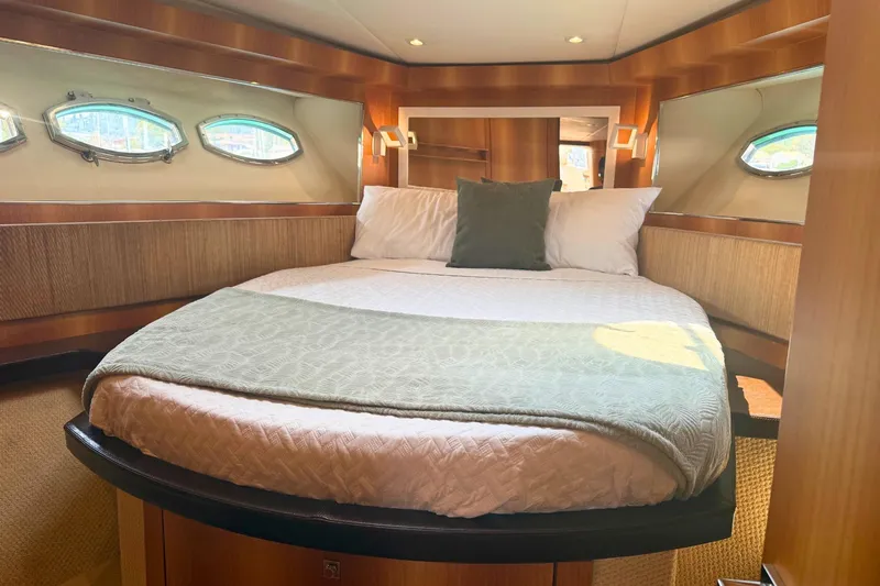  Yacht Photos Pics Luxurious cabin interior of a 2007 Absolute 56 HT yacht with cozy bedding.