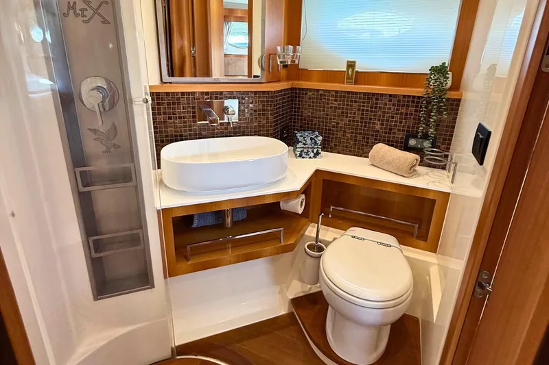  Yacht Photos Pics Luxurious bathroom in 2007 Absolute 56 HT yacht with modern fixtures and elegant design.