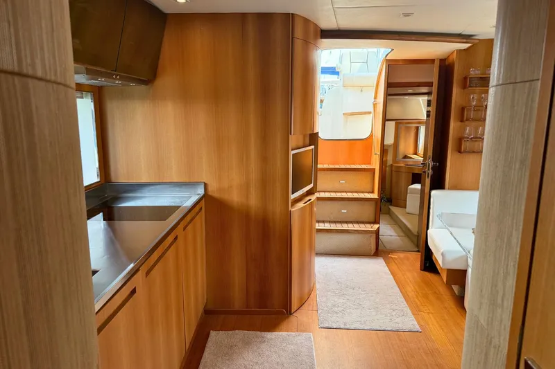  Yacht Photos Pics Luxurious interior of a 2007 Absolute 56 HT yacht with modern wood finishes.