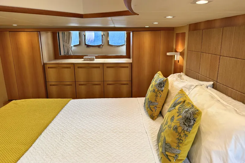  Yacht Photos Pics Luxurious bedroom interior of 2007 Absolute 56 HT yacht with elegant wood paneling.