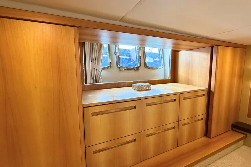  Yacht Photos Pics Luxurious wooden interior of 2007 Absolute 56 HT yacht with elegant cabinetry and window view.