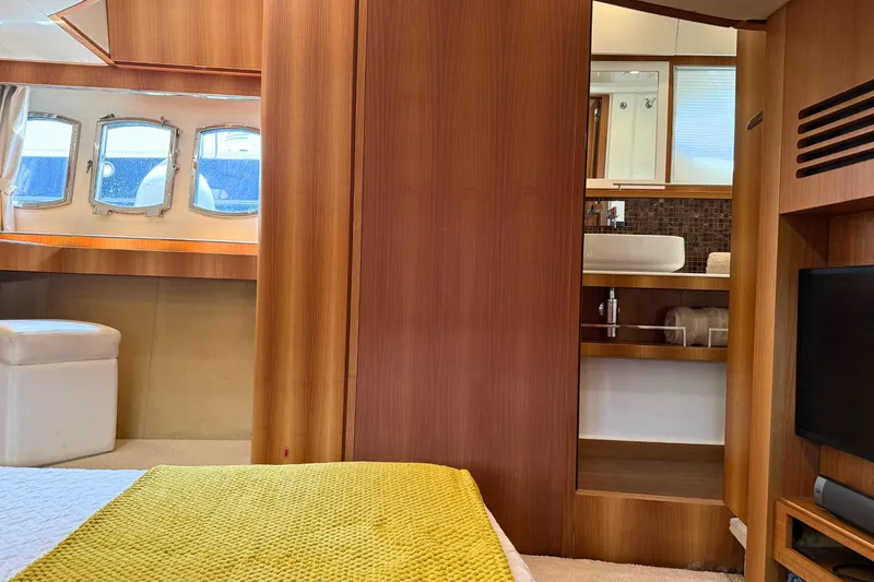  Yacht Photos Pics Luxurious interior of 2007 Absolute 56 HT yacht with wood paneling and modern amenities.