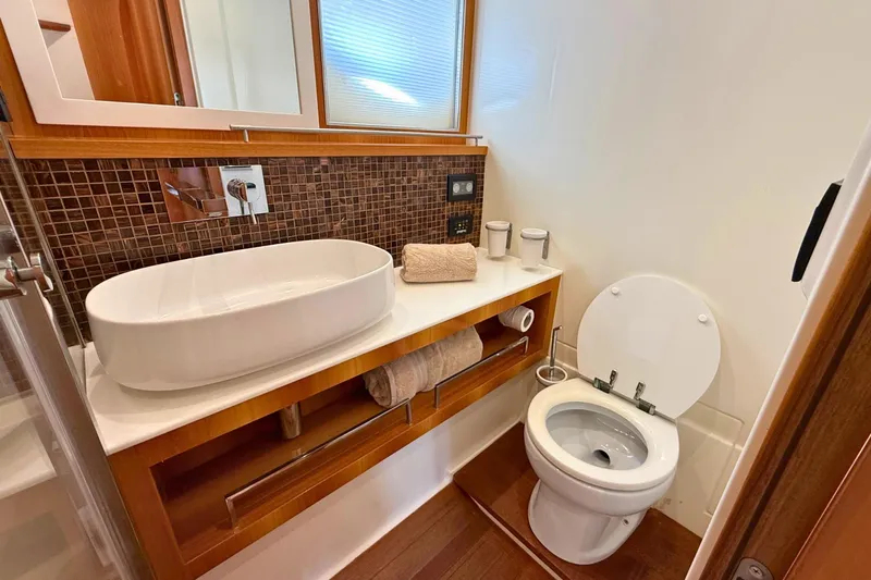  Yacht Photos Pics Luxurious bathroom in 2007 Absolute 56 HT yacht with modern sink and toilet.