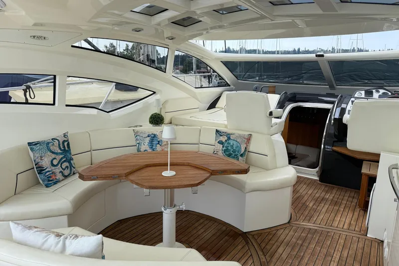  Yacht Photos Pics Luxurious 2007 Absolute 56 HT yacht interior with elegant seating and wooden table.