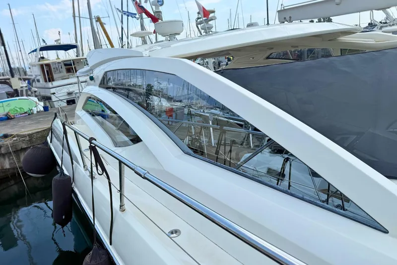  Yacht Photos Pics Luxury Absolute 56 HT yacht from 2007 docked at marina, showcasing sleek design.