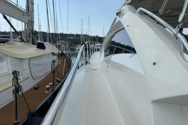  Yacht Photos Pics Side view of a 2007 Absolute 56 HT yacht docked at a marina.