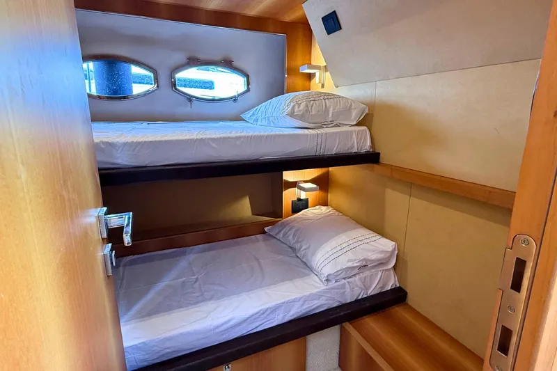  Yacht Photos Pics Bunk beds in 2007 Absolute 56 HT yacht cabin with porthole windows.