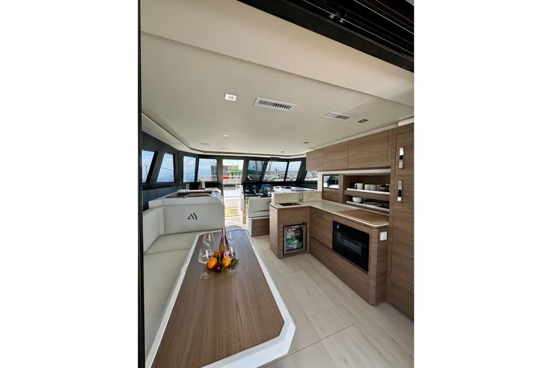  Yacht Photos Pics Luxurious interior of 2026 Aventura 38 Motor Yacht with modern kitchen and seating area.