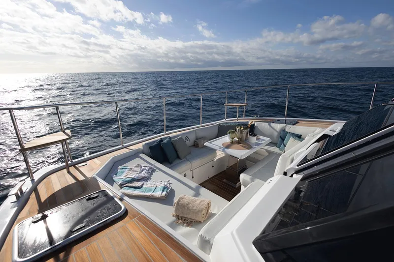  Yacht Photos Pics Luxurious Aventura 38 Motor Yacht 2026 with elegant deck seating, ocean view.