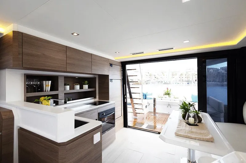  Yacht Photos Pics Luxurious interior of 2026 Aventura 38 Motor Yacht with modern kitchen and open deck view.