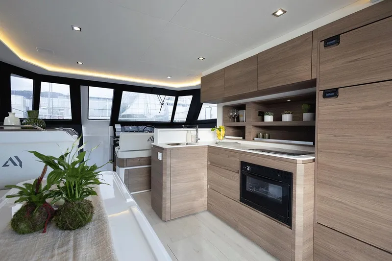  Yacht Photos Pics Luxurious interior of 2026 Aventura 38 Motor Yacht with modern kitchen design.