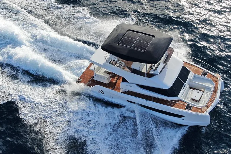  Yacht Photos Pics 2026 Aventura 38 Motor Yacht cruising on open water, featuring sleek design and solar panels.