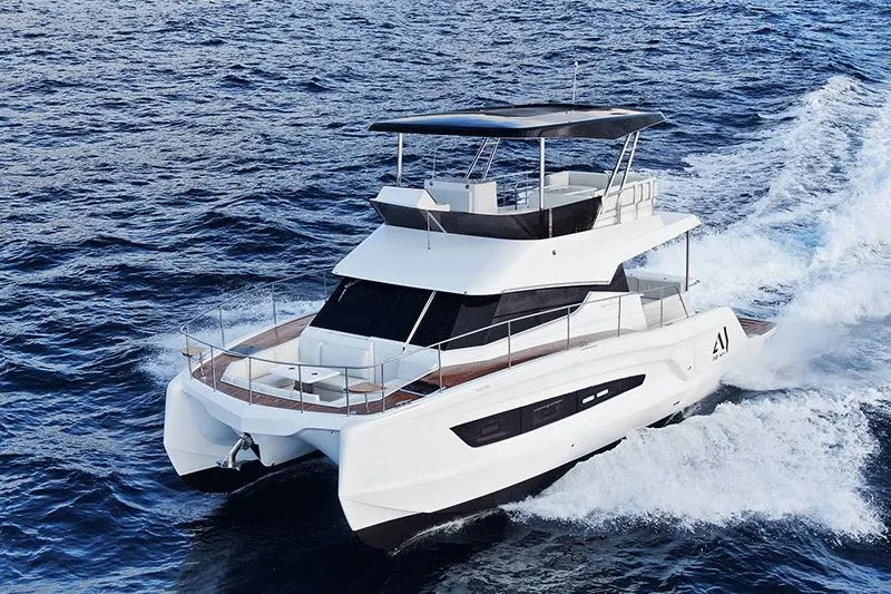  Yacht Photos Pics 2026 Aventura 38 Motor Yacht cruising on open sea, showcasing sleek design and luxury.