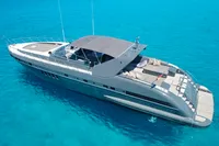Luxury 2004 Mangusta 80 Open yacht on clear blue water.