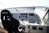 Cockpit of 2004 Mangusta 80 Open yacht with Sparco seat and control panel.