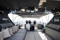 Luxurious 2004 Mangusta 80 Open yacht interior with modern seating and sleek design.