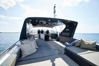 Luxurious 2004 Mangusta 80 Open yacht with spacious deck and plush seating.