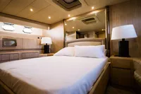 Luxurious bedroom interior of 2004 Mangusta 80 Open yacht with elegant lighting and modern furnishings.