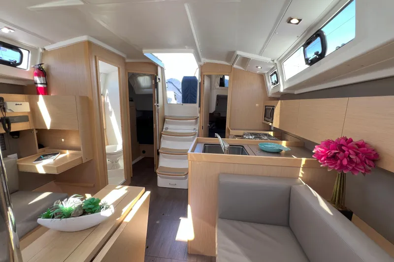 Grand Cru Yacht Photos Pics Interior of 2018 Beneteau Oceanis 38.1 yacht, featuring modern kitchen and seating area.