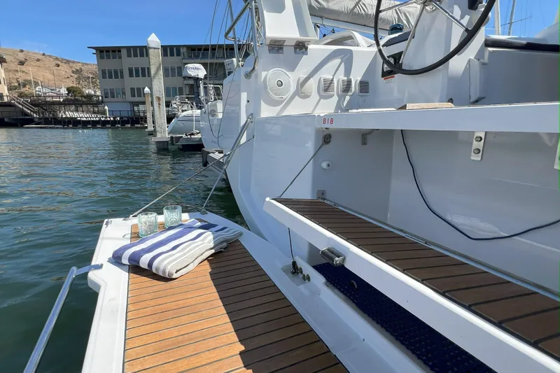 Grand Cru Yacht Photos Pics 2018 Beneteau Oceanis 38.1 yacht docked, featuring teak deck and nautical accessories.