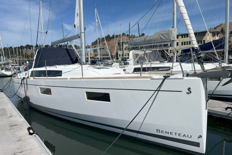 Grand Cru Yacht Photos Pics 2018 Beneteau Oceanis 38.1 sailboat docked in marina, sunny day.