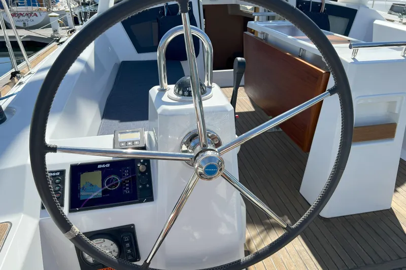 Grand Cru Yacht Photos Pics Steering wheel and navigation equipment on 2018 Beneteau Oceanis 38.1 sailboat.