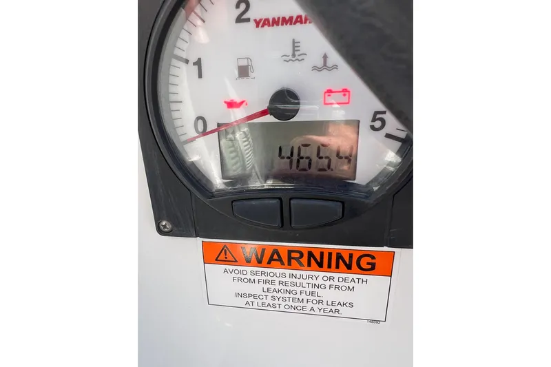 Grand Cru Yacht Photos Pics Yanmar engine gauge on 2018 Beneteau Oceanis 38.1, displaying 465.4 hours with warning label.