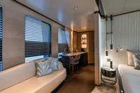 Luxurious 2023 Bilgin Custom yacht interior with modern decor, featuring a cozy seating area and desk.