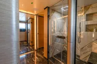 Luxurious Bilgin Custom 2023 yacht interior with elegant marble and glass design.