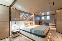 Luxurious modern bedroom on Bilgin Custom 2023 yacht, featuring elegant decor and ambient lighting.