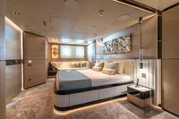 Luxurious modern bedroom interior on a 2023 Bilgin Custom yacht, featuring elegant decor and ambient lighting.