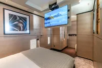 Luxurious 2023 Bilgin Custom yacht bedroom with modern decor and wall-mounted TV.
