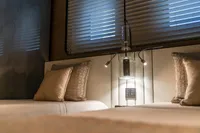 Luxurious bedroom interior with modern lighting, featuring Bilgin Custom 2023 design elements.