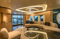 Luxurious yacht interior with modern lighting, plush seating, and elegant decor, Bilgin Custom 2023 model.