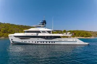 Luxurious 2023 Bilgin Custom yacht cruising on serene waters, surrounded by lush greenery.