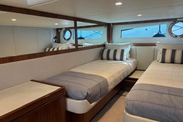  Yacht Photos Pics Interior of 2020 Riviera 4800 Sport Yacht with twin beds and elegant decor.