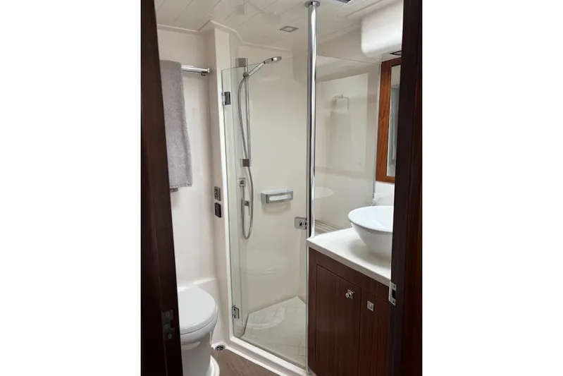  Yacht Photos Pics Luxurious bathroom in 2020 Riviera 4800 Sport Yacht with modern shower and vanity.