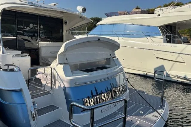  Yacht Photos Pics Riviera 4800 Sport Yacht 2020 docked, rear view with open storage, Chicago.