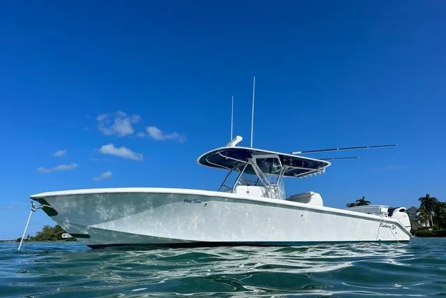  Yacht Photos Pics 2015 Bahama 34 boat on water under clear blue sky.