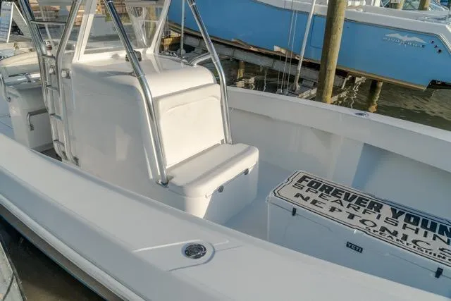  Yacht Photos Pics 2015 Bahama 34 boat with seating and storage, docked at a marina.