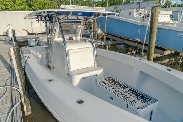  Yacht Photos Pics 2015 Bahama 34 boat docked, featuring a sleek design and spacious deck.