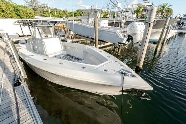  Yacht Photos Pics 2015 Bahama 34 boat docked at marina, featuring sleek design and spacious deck.